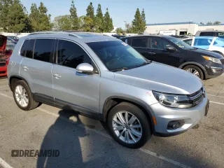 2013 Volkswagen Tiguan S with VIN WVGAV7AX8DW501081, listed as a Copart auction lot 88065365 with 157,312 mi miles and Salvage title. Bid and sale history available at DreamBid. Image 4.