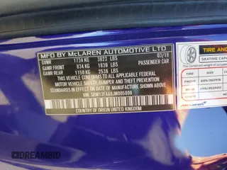 2018 McLaren 570S z VIN SBM13FAA8JW005006, wystawiony jako Copart lot #59641834 z przebiegiem 38 683 mil mil oraz Szkody całkowita. Historia ofert i sprzedaży dostępna na DreamBid. Obrazek 14.