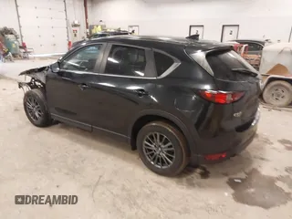 2021 Mazda CX-5 Touring with VIN JM3KFBCM1M1380409, listed as a IAAI auction lot 41677537 with 55,319 mi miles. Bid and sale history available at carsss.com. Image 3.