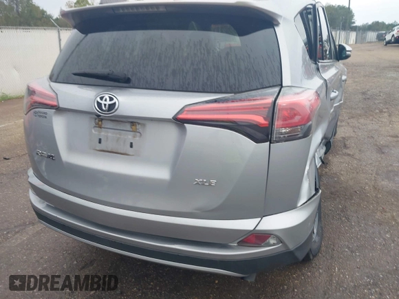 2018 Toyota RAV4 XLE with VIN 2T3WFREV3JW445654, listed as a IAAI auction lot 40849666 with 69,365 mi miles and . Bid and sale history available at DreamBid. Image 17.