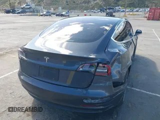 2019 Tesla Model 3 Mid Range with VIN 5YJ3E1EA6KF307456, listed as a IAAI auction lot 41944454 with 99,059 mi miles and . Bid and sale history available at DreamBid. Image 4.