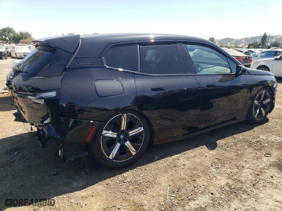 2023 BMW iX M60 with VIN WB533CF0XPCM48411, listed as a Copart auction lot 66606474 with 11,867 mi miles and Salvage Title. Bid and sale history available at carsss.com. Image 3.