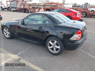 2003 Mercedes-Benz SLK-Class 3.2L with VIN WDBKK65F43F281612, listed as a IAAI auction lot 41674178 with 153,517 mi miles. Bid and sale history available at carsss.com. Image 3.