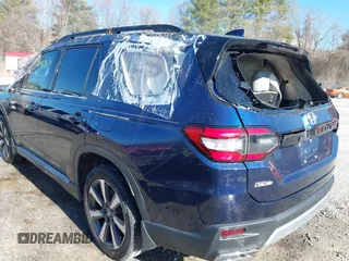 2023 Honda Pilot Touring with VIN 5FNYG2H77PB013559, listed as a IAAI auction lot 41620387 with 59,721 mi miles. Bid and sale history available at carsss.com. Image 3.