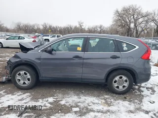 2015 Honda CR-V LX with VIN 2HKRM4H3XFH619055, listed as a IAAI auction lot 40989227 with 113,332 mi miles and . Bid and sale history available at DreamBid. Image 14.