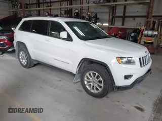 2014 Jeep Grand Cherokee Laredo with VIN 1C4RJFAG4EC309401, listed as a IAAI auction lot 41996233 with 243,541 mi miles and . Bid and sale history available at DreamBid. Image 1.