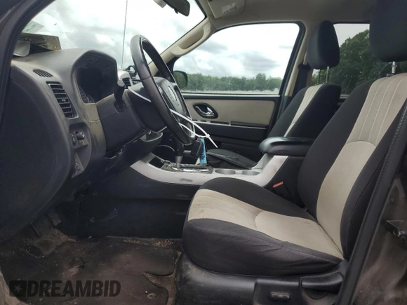 2007 Mercury Mariner Luxury with VIN 4M2YU91137KJ11539, listed as a Copart auction lot 64846175 with 139,488 mi miles and Salvage title. Bid and sale history available at DreamBid. Image 7.