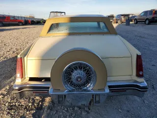 1985 Cadillac Eldorado z VIN 1G6EL5781FE647818, wystawiony jako Copart lot #77608224 z przebiegiem 7192 mil mil oraz Tytuł czysty. Historia ofert i sprzedaży dostępna na DreamBid. Obrazek 6.