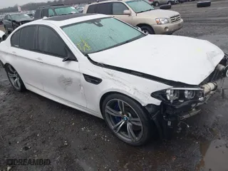 2014 BMW M5 with VIN WBSFV9C58ED594014, listed as a IAAI auction lot 41404323 with 101,049 mi miles. Bid and sale history available at carsss.com. Image 1.