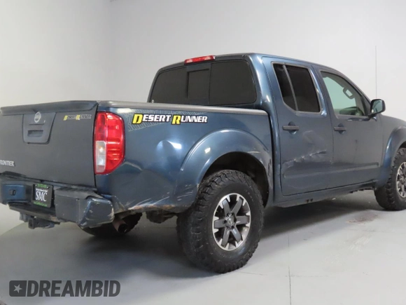 2014 Nissan Frontier SV with VIN 1N6AD0ERXEN763554, listed as a Copart auction lot 64313295 with 109,756 mi miles and Salvage title. Bid and sale history available at DreamBid. Image 3.