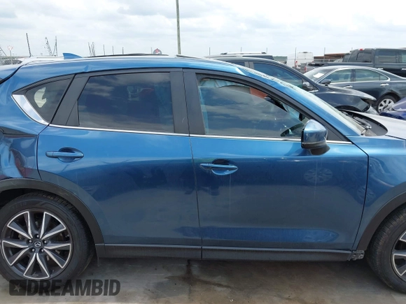 2018 Mazda CX-5 Touring z VIN JM3KFACM5J1442416, wystawiony jako IAAI lot #42093137 z przebiegiem 65 102 mil mil oraz . Historia ofert i sprzedaży dostępna na DreamBid. Obrazek 14.