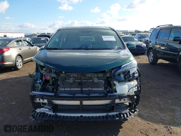 2024 Toyota Sienna XLE with VIN 5TDJSKFC7RS135935, listed as a IAAI auction lot 41409630 with 5,477 mi miles and . Bid and sale history available at DreamBid. Image 13.