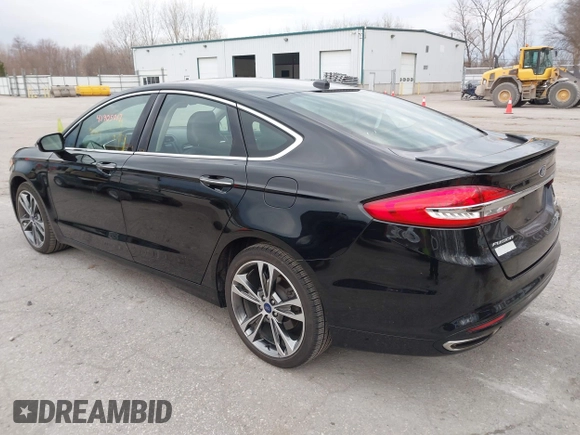 2017 Ford Fusion Titanium z VIN 3FA6P0K98HR200272, wystawiony jako IAAI lot #41905017 z przebiegiem 104 132 mil mil oraz . Historia ofert i sprzedaży dostępna na DreamBid. Obrazek 3.