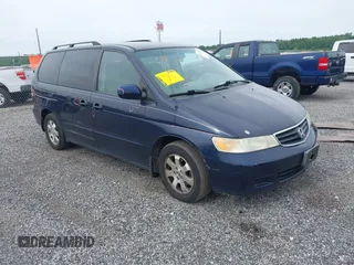 2004 Honda Odyssey EX-L z VIN 5FNRL18904B001048, wystawiony jako IAAI lot #42347427 z przebiegiem 200 611 mil mil oraz . Historia ofert i sprzedaży dostępna na DreamBid. Obrazek 1.