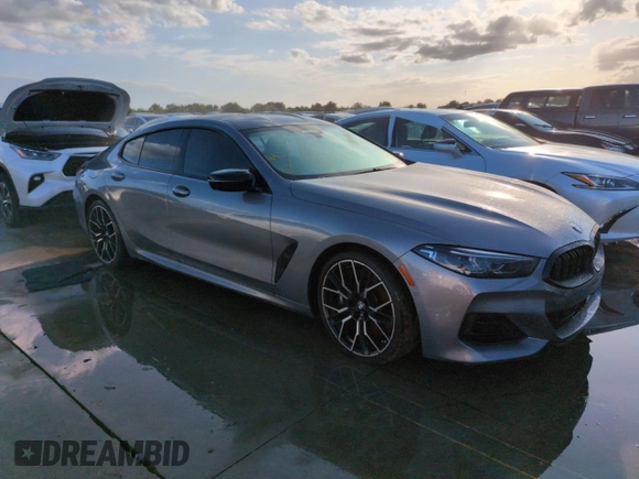 2023 BMW 8 Series M850i z VIN WBAGV8C02PCL20503, wystawiony jako Copart lot #74098614 z przebiegiem Nie podano mil oraz Szkoda całkowita • Salvage title. Historia ofert i sprzedaży dostępna na DreamBid. Obrazek 4.