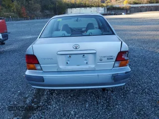 1997 Toyota Tercel CE z VIN JT2AC52L1V0227973, wystawiony jako Copart lot #77300554 z przebiegiem 301 799 mil mil oraz Szkoda całkowita • Salvage title. Historia ofert i sprzedaży dostępna na DreamBid. Obrazek 6.