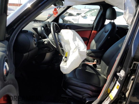 2016 MINI Countryman with VIN WMWZB3C58GWR47074, listed as a Copart auction lot 57174885 with 83,062 mi miles and Salvage title. Bid and sale history available at DreamBid. Image 7.