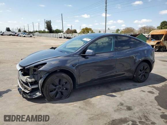 2025 Tesla Model Y Long Range with VIN 7SAYGDED8SF241779, listed as a Copart auction lot 51899205 with 12,409 mi miles and Salvage Title. Bid and sale history available at DreamBid. Image 1.