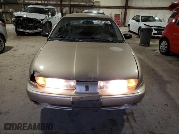 1999 Saturn SL z VIN 1G8ZK5277XZ266298, wystawiony jako Copart lot #41371855 z przebiegiem 85 882 mil mil oraz Szkoda całkowita • Salvage title. Historia ofert i sprzedaży dostępna na DreamBid. Obrazek 5.