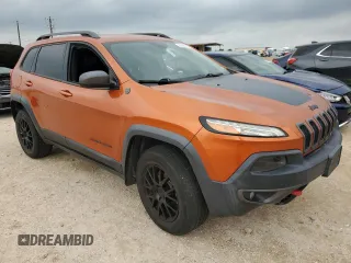 2015 Jeep Cherokee Trailhawk with VIN 1C4PJMBSXFW757382, listed as a Copart auction lot 53566885 with 139,972 mi miles and Clean Title. Bid and sale history available at carsss.com. Image 4.