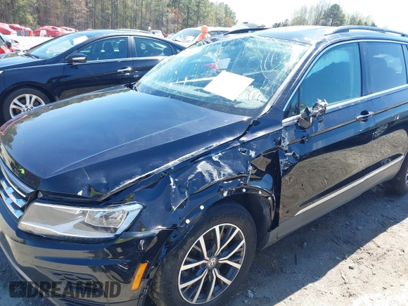 2020 Volkswagen Tiguan SE with VIN 3VV3B7AX1LM139519, listed as a IAAI auction lot 41890276 with 147,303 mi miles and . Bid and sale history available at DreamBid. Image 6.