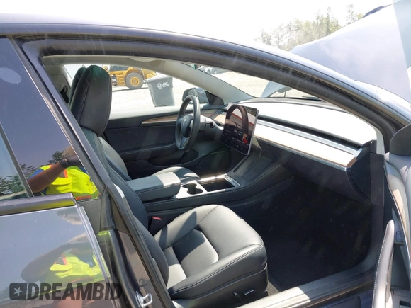 2023 Tesla Model 3 with VIN 5YJ3E1EA6PF664045, listed as a IAAI auction lot 42561039 with 18,708 mi miles and . Bid and sale history available at DreamBid. Image 5.