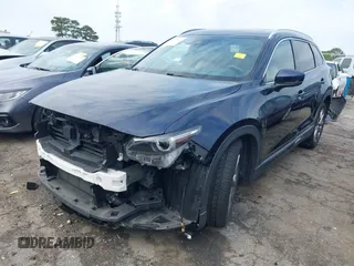 2021 Mazda CX-9 Carbon Edition with VIN JM3TCADY1M0516505, listed as a IAAI auction lot 42016644 with 50,900 mi miles and . Bid and sale history available at carsss.com. Image 2.