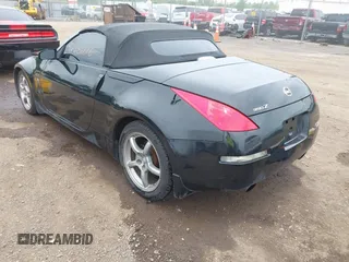 2006 Nissan 350Z Touring z VIN JN1AZ36A76M456514, wystawiony jako IAAI lot #42266616 z przebiegiem 129 729 mil mil oraz . Historia ofert i sprzedaży dostępna na DreamBid. Obrazek 3.