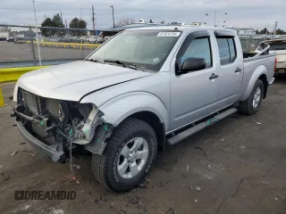 2010 Nissan Frontier SE with VIN 1N6AD0FVXAC420020, listed as a Copart auction lot 87324794 with 145,566 mi miles and Salvage title. Bid and sale history available at DreamBid. Image 1.