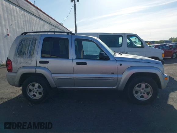 2003 Jeep Liberty Limited z VIN 1J8GL58K73W694818, wystawiony jako IAAI lot #42032227 z przebiegiem 217 446 mil mil oraz . Historia ofert i sprzedaży dostępna na DreamBid. Obrazek 13.