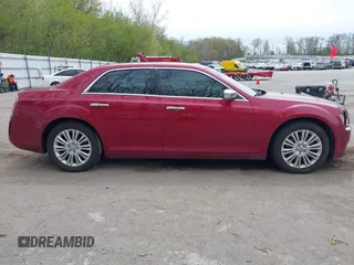 2012 Chrysler 300 C with VIN 2C3CCAKTXCH220185, listed as a IAAI auction lot 42110327 with 57,682 mi miles and . Bid and sale history available at DreamBid. Image 13.