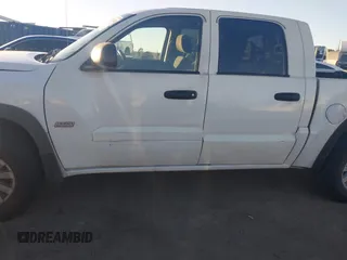 2006 Mitsubishi Raider Duro Cross with VIN 1Z7HC38K36S576409, listed as a IAAI auction lot 41410982 with 152,476 mi miles. Bid and sale history available at carsss.com. Image 14.