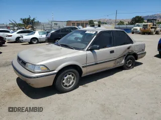 1992 Toyota Corolla with VIN 1NXAE94A1NZ319755, listed as a Copart auction lot 61456695 with 247,137 mi miles and Salvage title. Bid and sale history available at DreamBid. Image 1.
