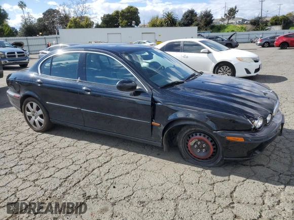 2004 Jaguar X-Type with VIN SAJEA51C74WD56736, listed as a Copart auction lot 48038295 with 115,817 mi miles and Salvage Title. Bid and sale history available at DreamBid. Image 4.