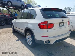 2011 BMW X5 35i with VIN 5UXZV4C54BL410338, listed as a IAAI auction lot 41930266 with 148,950 mi miles. Bid and sale history available at carsss.com. Image 3.