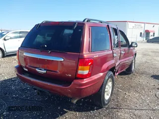 1999 Jeep Grand Cherokee Limited with VIN 1J4GW68N3XC770468, listed as a IAAI auction lot 41793600 with 65,277 mi miles. Bid and sale history available at carsss.com. Image 4.