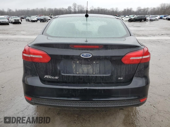 2017 Ford Focus SE with VIN 1FADP3F2XHL316724, listed as a Copart auction lot 52321155 with 137,005 mi miles and Salvage Title. Bid and sale history available at DreamBid. Image 6.