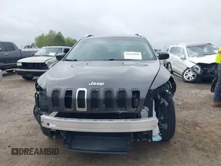 2015 Jeep Cherokee Latitude with VIN 1C4PJLCB0FW601862, listed as a IAAI auction lot 41931048 with 100,705 mi miles and . Bid and sale history available at DreamBid. Image 13.