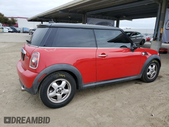 2009 MINI Hardtop with VIN WMWMF33519TW77558, listed as a Copart auction lot 54556785 with 97,749 mi miles and Salvage Title. Bid and sale history available at DreamBid. Image 3.