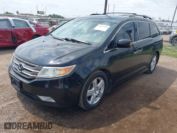 2013 Honda Odyssey Touring with VIN 5FNRL5H95DB086041, listed as a IAAI auction lot 42477974 with 213,343 mi miles and . Bid and sale history available at DreamBid. Image 2.