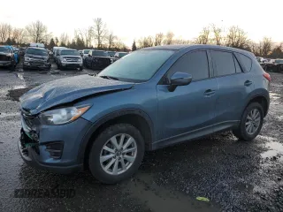2016 Mazda CX-5 Sport with VIN JM3KE4BY3G0876082, listed as a Copart auction lot 86438024 with 203,544 mi miles and Salvage Title. Bid and sale history available at carsss.com. Image 1.