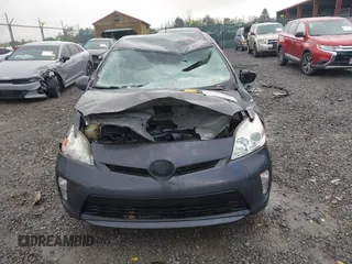 2015 Toyota Prius Four z VIN JTDKN3DU2F0439833, wystawiony jako IAAI lot #42216345 z przebiegiem 96 872 mil mil oraz . Historia ofert i sprzedaży dostępna na DreamBid. Obrazek 13.