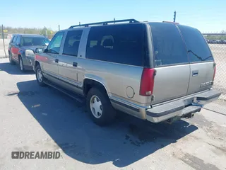 1999 Chevrolet Suburban with VIN 3GNEC16R9XG253081, listed as a IAAI auction lot 41719007 with 196,884 mi miles. Bid and sale history available at carsss.com. Image 3.