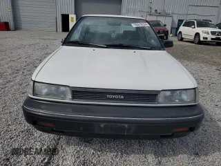 1990 Toyota Corolla z VIN 1NXAE94A0LZ089770, wystawiony jako Copart lot #75318334 z przebiegiem 161 894 mil mil oraz Szkoda całkowita • Salvage title. Historia ofert i sprzedaży dostępna na DreamBid. Obrazek 5.