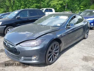 2014 Tesla Model S P85D with VIN 5YJSA1H29EFP63032, listed as a IAAI auction lot 42132145 with Not Provided miles and . Bid and sale history available at DreamBid. Image 2.