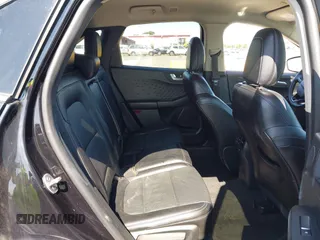 2020 Ford Escape Titanium z VIN 1FMCU9J97LUB18350, wystawiony jako IAAI lot #42574736 z przebiegiem 82 551 mil mil oraz . Historia ofert i sprzedaży dostępna na DreamBid. Obrazek 8.