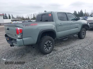 2023 Toyota Tacoma 4WD SR with VIN 3TMCZ5AN3PM621797, listed as a IAAI auction lot 41627120 with 14,326 mi miles. Bid and sale history available at carsss.com. Image 4.