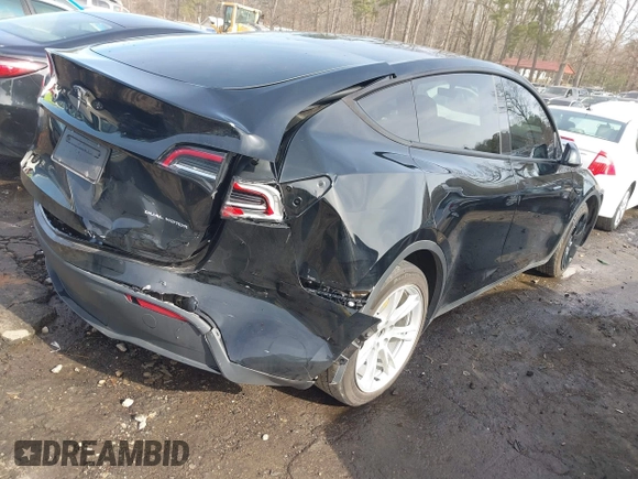 2023 Tesla Model Y Long Range z VIN 7SAYGAEE5PF603128, wystawiony jako IAAI lot #41328797 z przebiegiem 63 527 mil mil oraz . Historia ofert i sprzedaży dostępna na DreamBid. Obrazek 4.