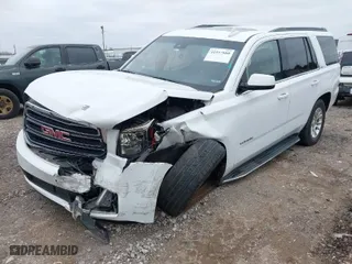 2019 GMC Yukon SLT with VIN 1GKS2BKC6KR183607, listed as a IAAI auction lot 41557880 with 120,971 mi miles. Bid and sale history available at carsss.com. Image 2.