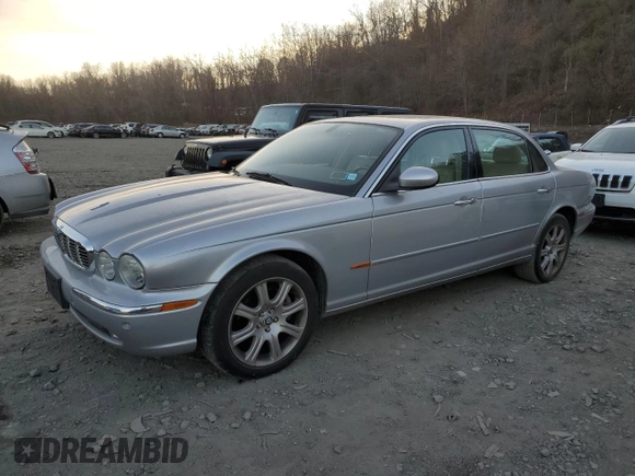 2005 Jaguar XJ with VIN SAJWA79C55SG37981, listed as a Copart auction lot 81142484 with 128,601 mi miles and Salvage Title. Bid and sale history available at carsss.com. Image 1.